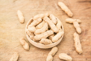 A pile of peanuts in a bamboo basket