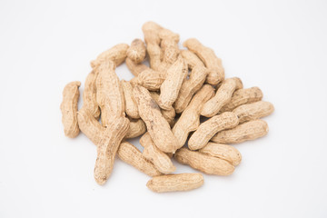 A pile of peanuts in a bamboo basket