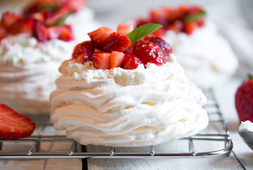 Delicious Pavlova cake with meringue and fresh strawberries