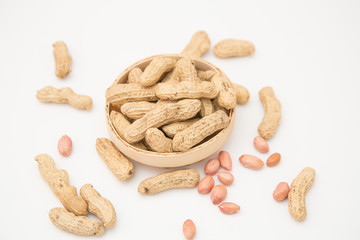A pile of peanuts in a bamboo basket