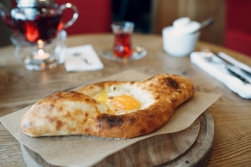 Adjarian khachapuri with suluguni cheese and egg