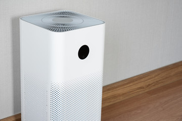 Indoor air purifier with digital monitor screen in bedroom, that show air quality in the room and...