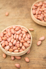 A pile of peanuts in a bamboo basket