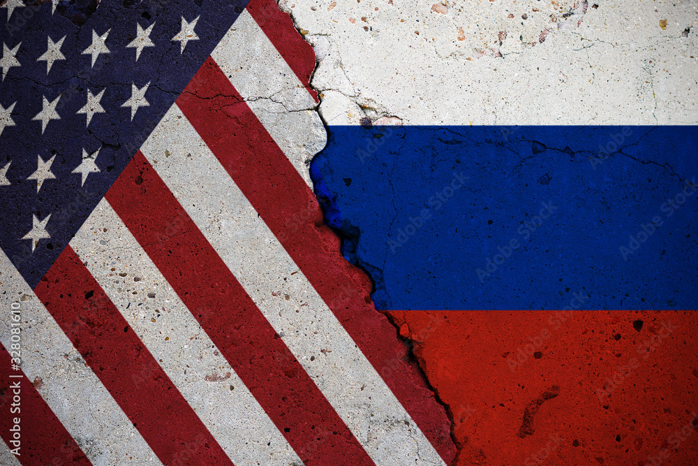 Wall mural Concrete slab with large cracks, flags of the USA and the Russian Federation. Abstract concept of breakup and conflict problems. Background