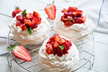 Delicious Pavlova cake with meringue and fresh strawberries