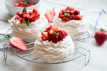 Delicious Pavlova cake with meringue and fresh strawberries
