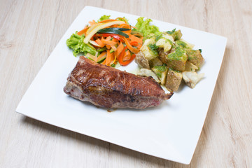 Premium Meat Cut   Beef Cuts - Sterling Silver, accompanied by vegetables and potatoes