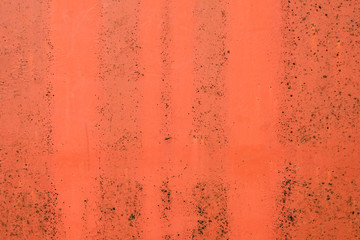 Red old iron plate surface in worn and rusty condition. Weathered steel material aged, rusty and corrosive condition. Ideal for wallpaper, background with copy space for text.