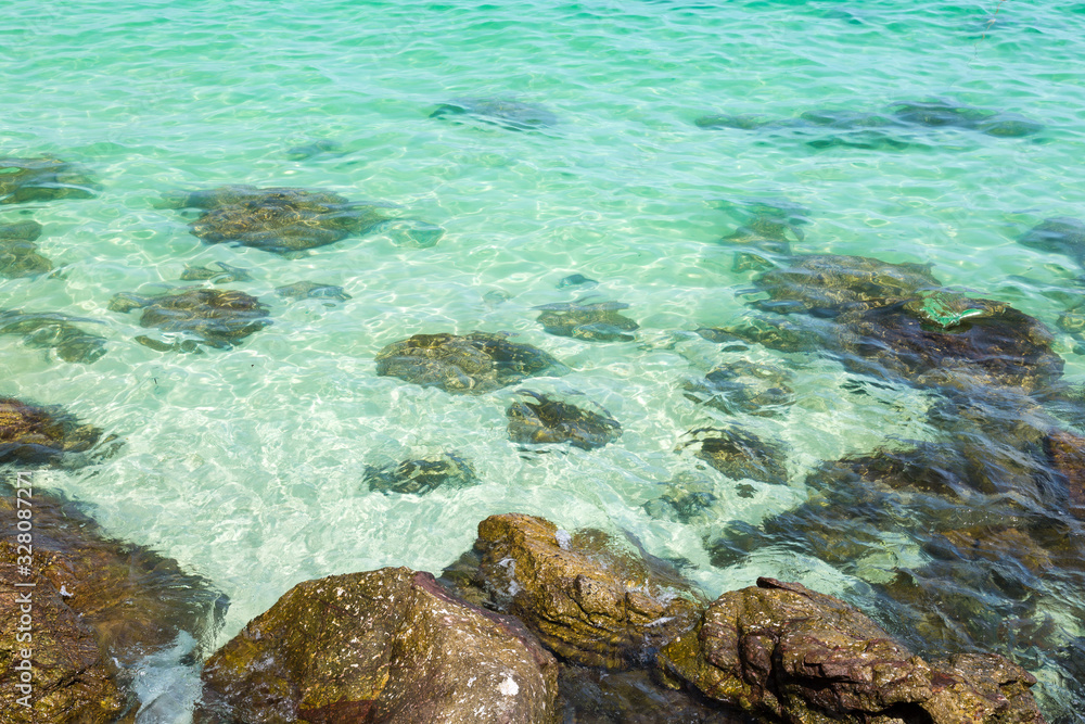 Wall mural Clear water sea and beach, wave, wind, stone, reef ,white sand relax on holiday or vacation at Thailand Chonburi Sattahip