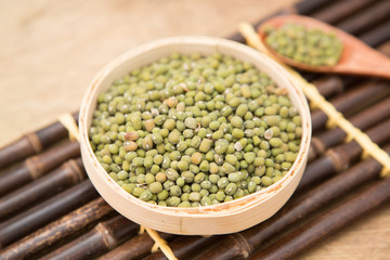 A pile of green beans in the bamboo basket