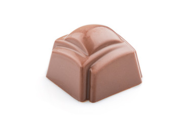 Single chocolate candy isolated on white background. side view.
