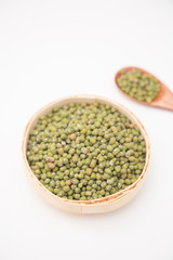 A pile of green beans in the bamboo basket