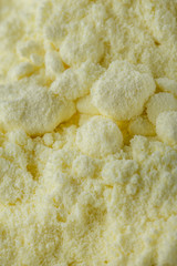 purified sulfur powder on a white acrylic background