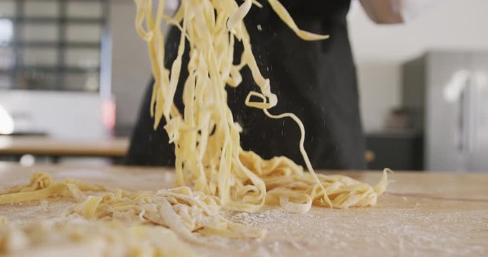 Chef separating pasta