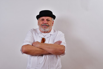 Happy  old man with his arms crossed.Elderly gentleman looking smug.Senior man proud as can be.