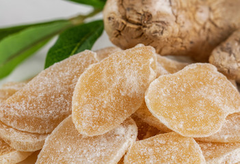 Sweet and Spicy Candied Ginger in a Bowl on light background