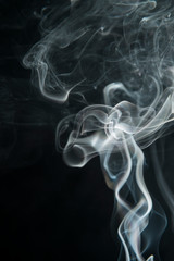 White smoke on black background