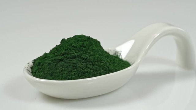 Super food vitamins and minerals in spirulina for vegetarians and a healthy life. On a white background close-up.