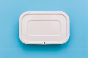 White container for food on a blue background. Packaging for storing breakfast, dinner or lunch.