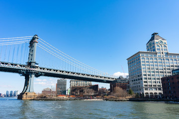 Fototapeta na wymiar The Manhattan Bridge and the Waterfront in Dumbo Brooklyn New York along the East River