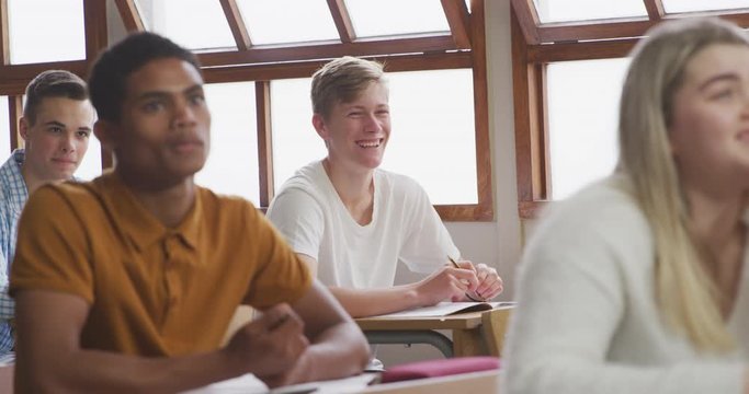 Student smiling in high school class