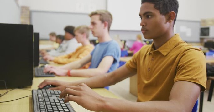 Students working on computers in high school class