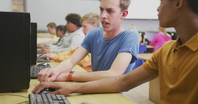 Students working on computers in high school class