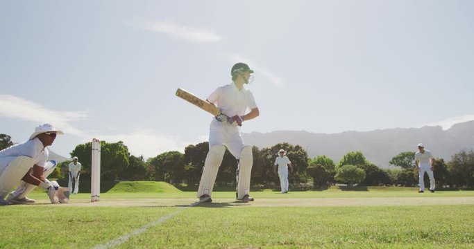 Cricket players training on the pitch