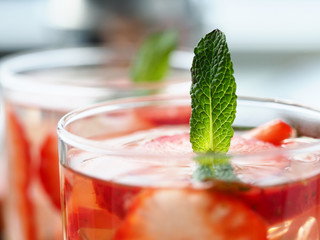 Close-up glass with cocktail, strawberry mint