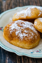 Mandazi is a slightly sweet East African Street Food; spicy, airy yeast doughnut dough made with...