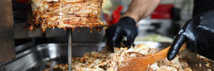 Close-up meat on special equipment, cook shawarma - obrazy, fototapety, plakaty