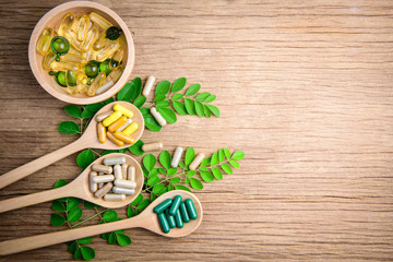 Herbal medicine, vitamin and supplements nutrition for good healthy on wooden background, medicine and drug concept