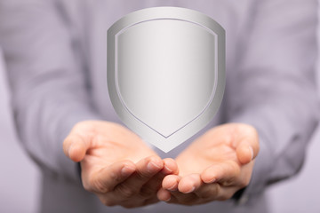 shield protection concept holding in hand digital