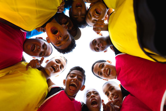 Low angle view of soccer team in circle