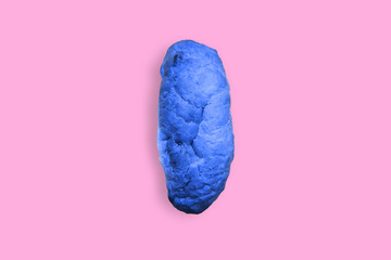 Naklejka premium Blue bread on a pink background. Contemporary art, pop art.