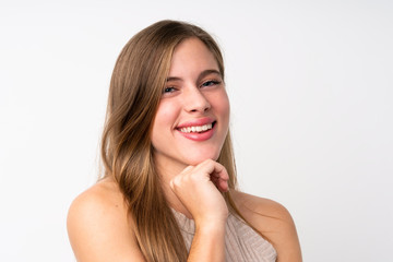 Fototapeta premium Portrait of beautiful teenager blonde girl over isolated white background