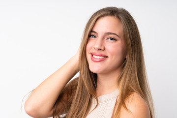 Naklejka premium Portrait of beautiful teenager blonde girl over isolated white background