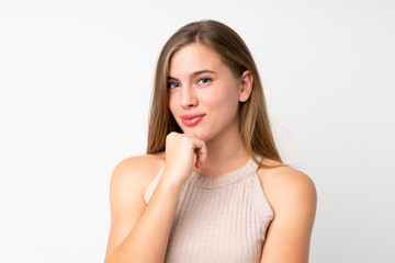 Fototapeta premium Portrait of beautiful teenager blonde girl over isolated white background