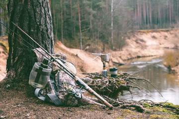 Fishing equipment on the river bank.