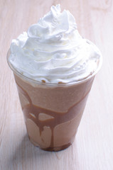 Chocolate and arequipe milkshake accompanied by nut chunks