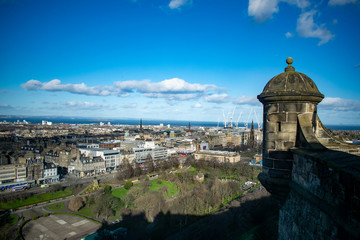 panoramic view of Edinburgh inside the castle in edimburgh city, scotland on the rocks with a blue...