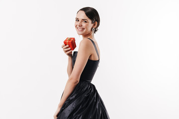 Attractive young brunette woman wearing black cocktail dress