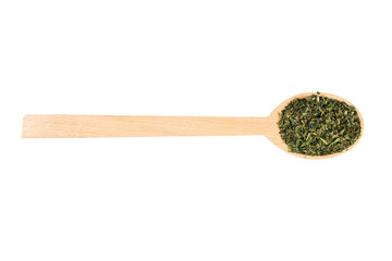 dried nettle herb or in latin Utricae folium in wooden spoon isolated on white background. medicinal healing herbs. herbal medicine. alternative medicine