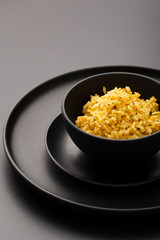 Delicious wild rice on a black bowl high view