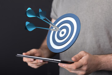 Dart arrow on target dartboard, Business success concept..