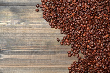 Coffee beans on wood background. Banner with copy-space