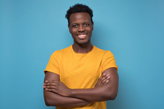 Black African American Young Man In Yellow T-shirt With Cheerful Attitude