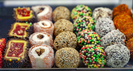 Oriental sweets Lukum. Turkish delight on sale in food store.