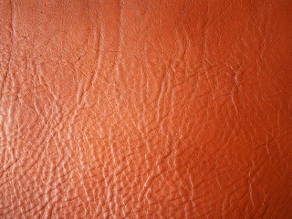 Orange background. Genuine Leather. Leather texture. Vegetable tanned leather. Design. Production of leather good