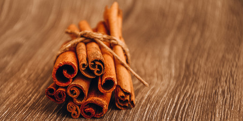 cinnamon sticks on the table, beautiful christmas background with spices, copy space